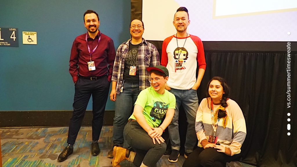 A group photo of the Queering Comics Panel