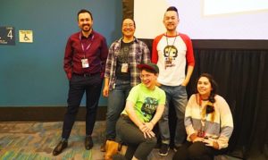A group photo of the Queering Comics Panel