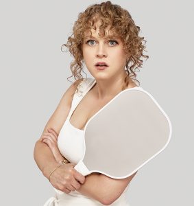 Caroline Neff holding a pickleball paddle