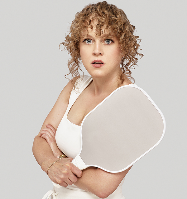 Caroline Neff holding a pickleball paddle