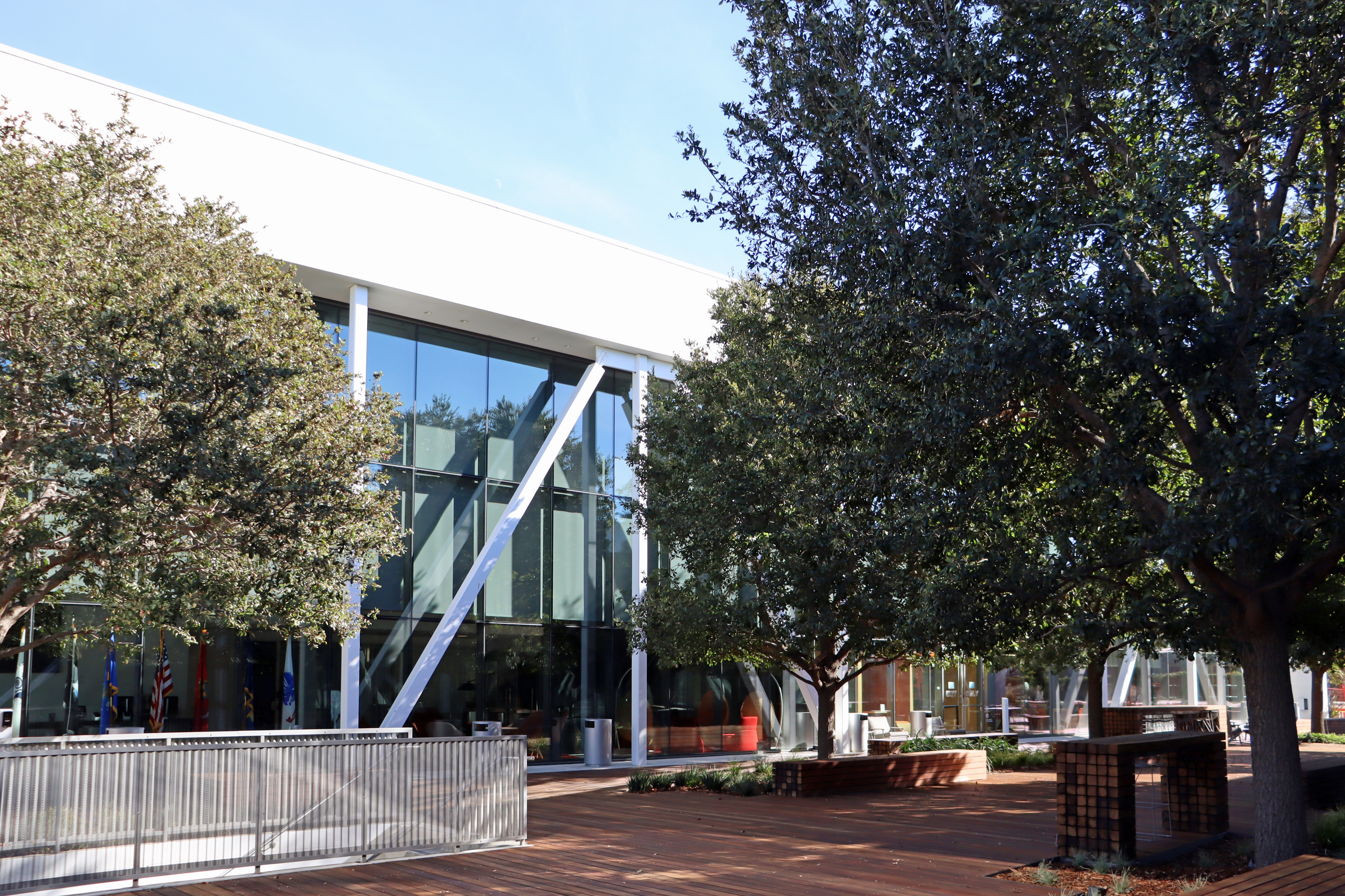 Glass-fronted office building and trees at 2701 Olympic Boulevard in Santa Monica.