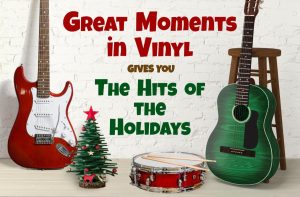 Guitars, a drum and a small Christmas tree in artwork for Great Moments in Vinyl’s Hits of the Holidays.