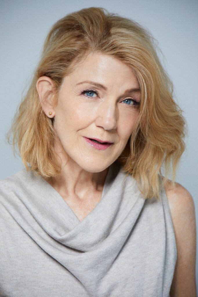 Victoria Clark wearing a gray sleeveless cowl-neck top in a portrait by Sophie Elgort.